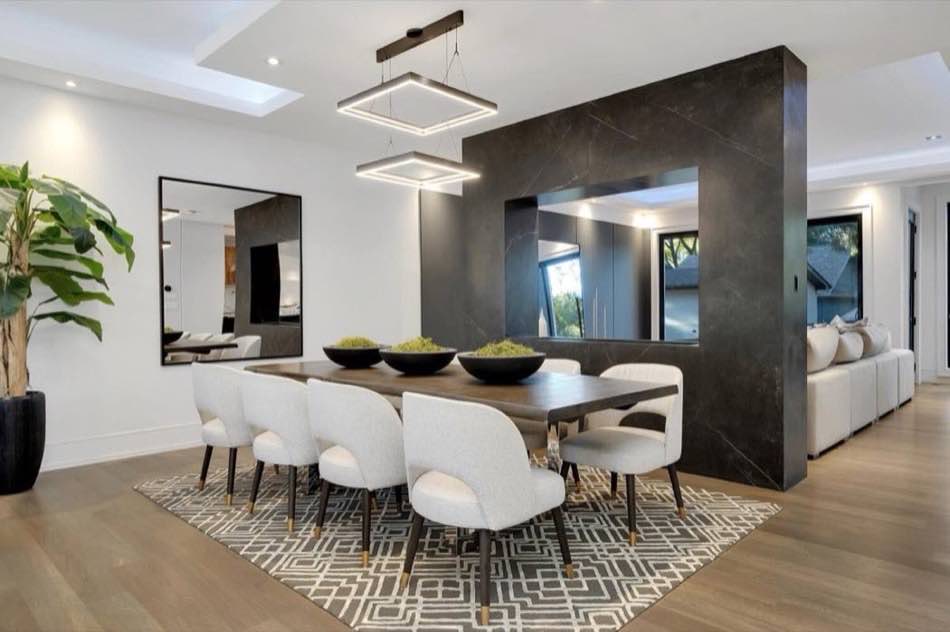 Dining room with stone feature wall in a Toronto custom home