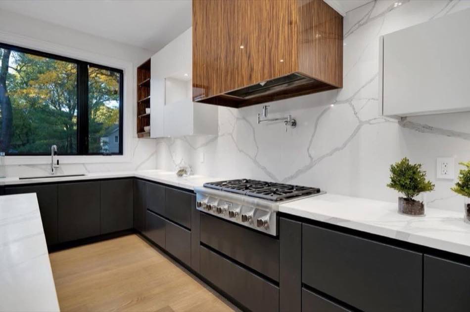 Designer chef's kitchen with marble island in a custom home