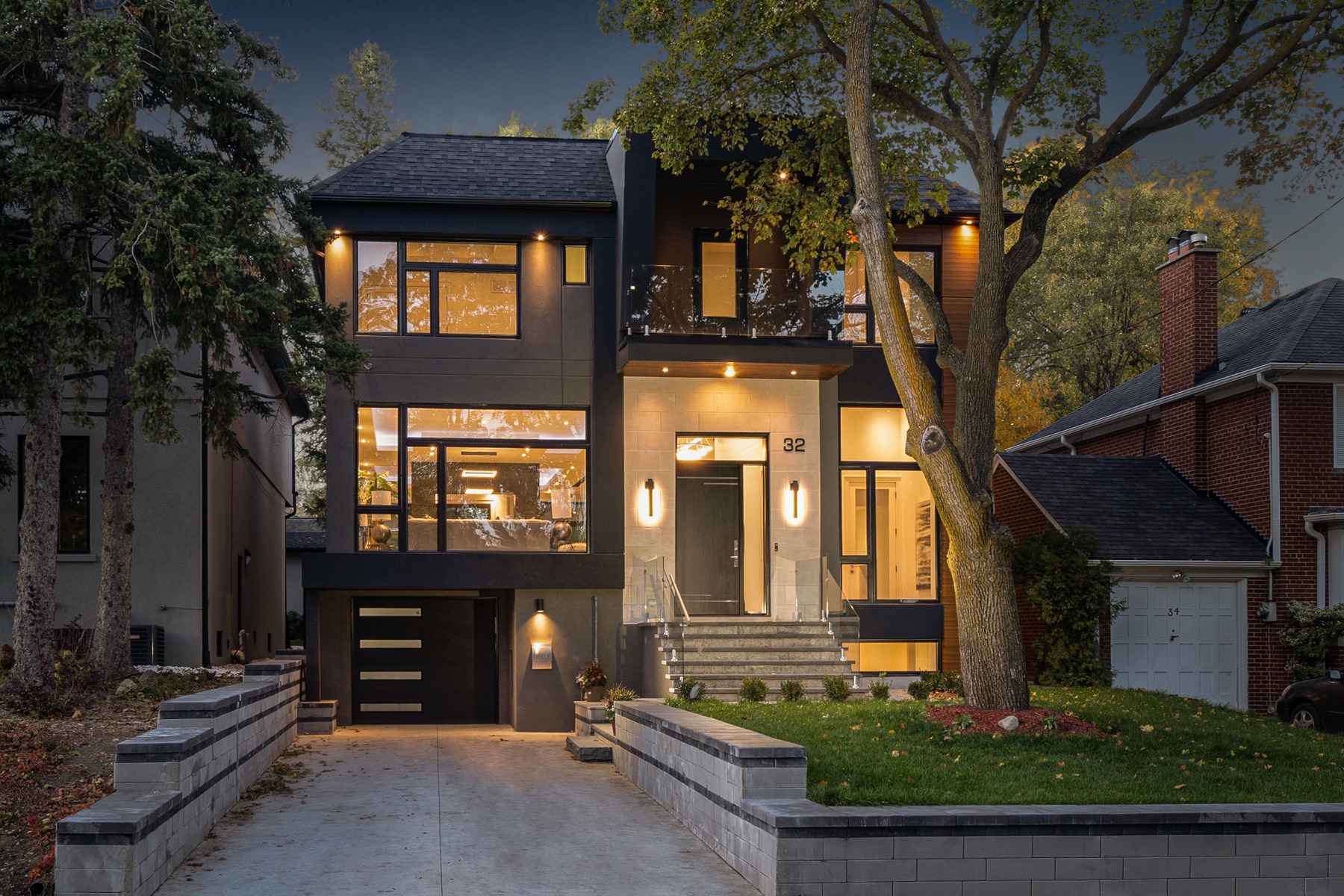 Custom modern home exterior at dusk in Etobicoke, Toronto