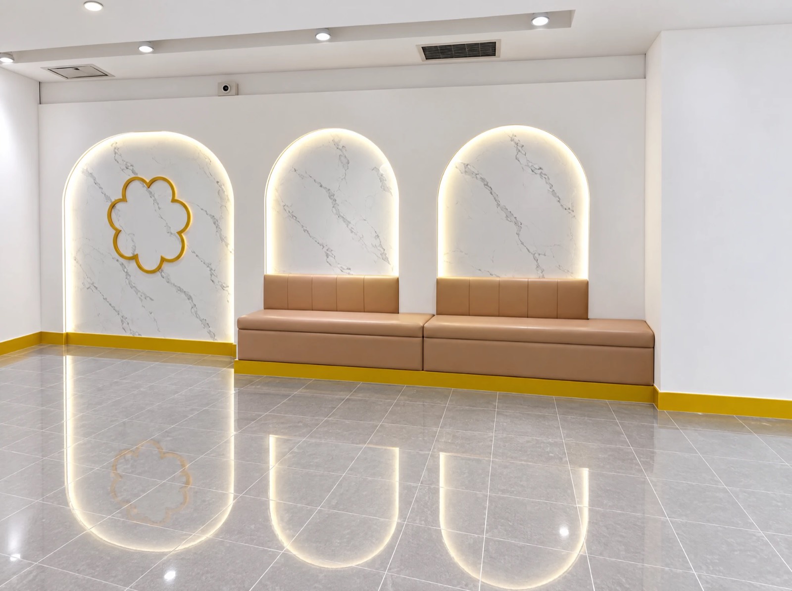 Marry Me Mochi interior — backlit arched marble niches with banquette seating, custom millwork by Atena Construction