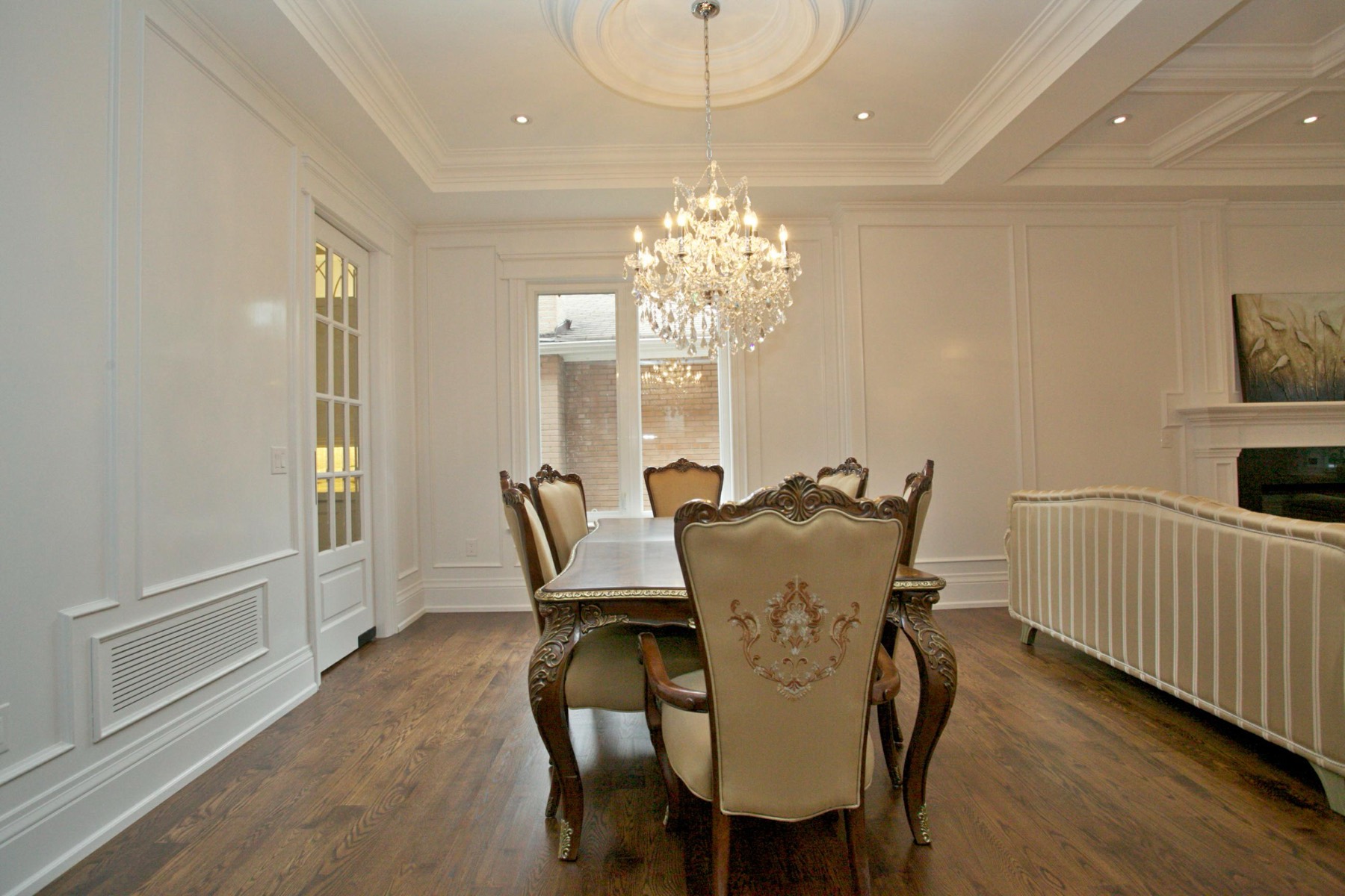 Formal dining room with coffered ceiling in a North York custom home
