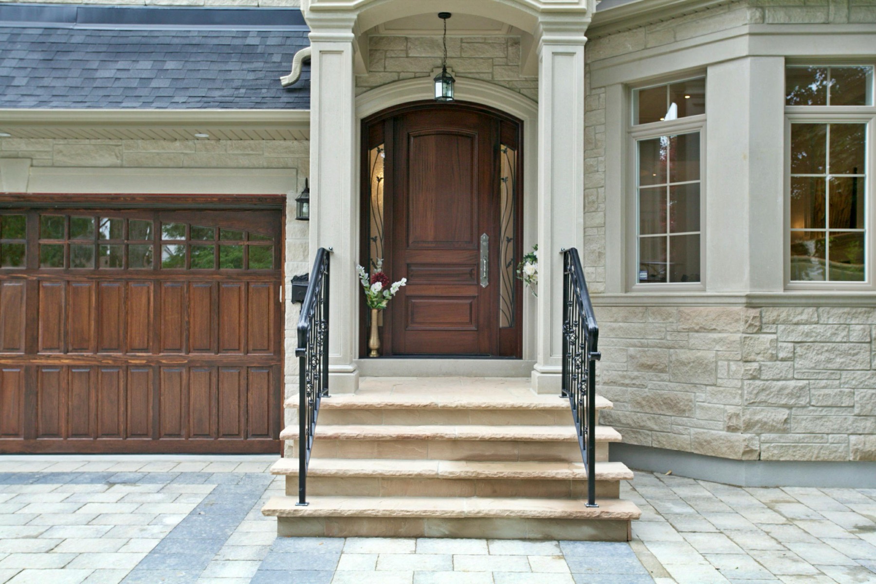 Grand stone entry and front door of a custom luxury home in North York, Toronto