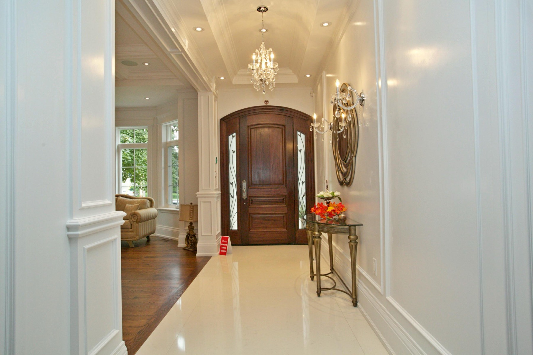 Dramatic entrance foyer with hardwood floors in a custom Toronto home