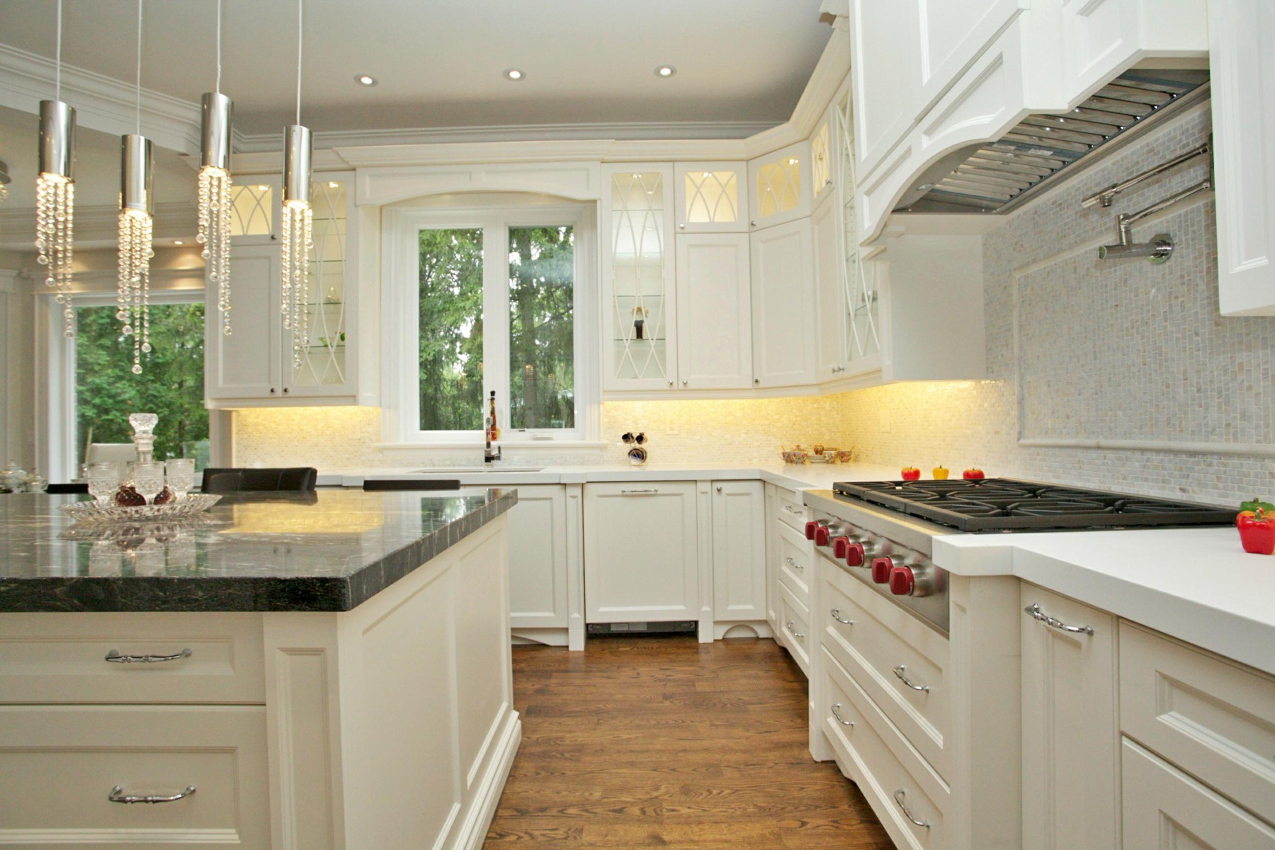 Designer chef's kitchen with a large island in a custom Toronto home