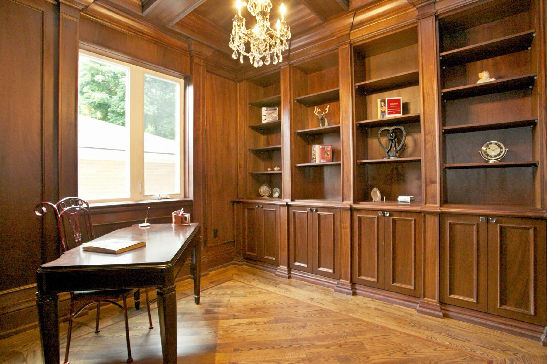 Wood-panelled home library and study in a custom luxury home